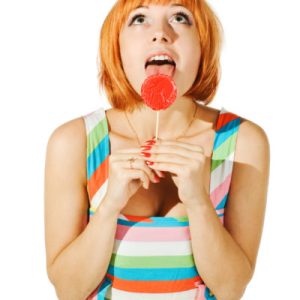 a girl with a lollipop